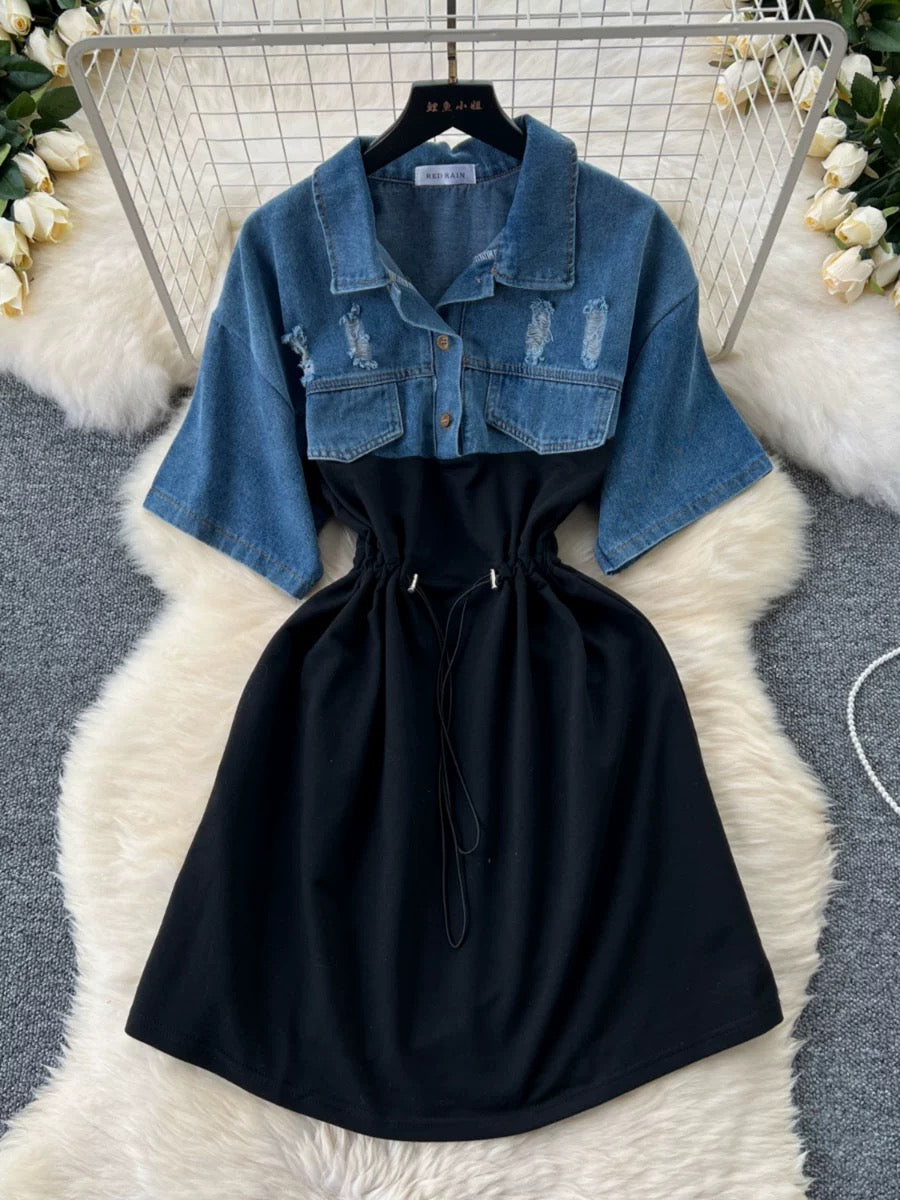 Black dress with denim jacket on a white fur rug