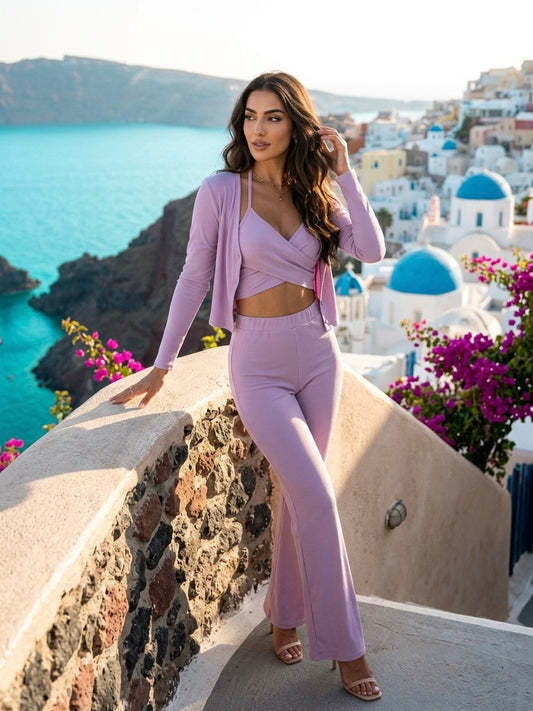 Woman wearing a lilac ribbed three-piece co-ord set on a Santorini-inspired vacation overlooking the sea