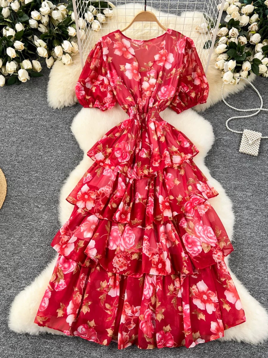 Woman wearing Scarlet Bloom floral tiered maxi dress at a luxury resort 
