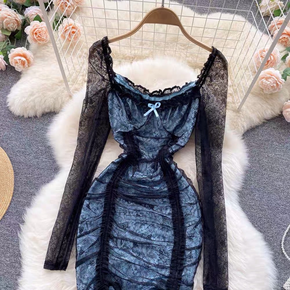 Close-up of floral lace fabric and ruched detailing on black mini dress