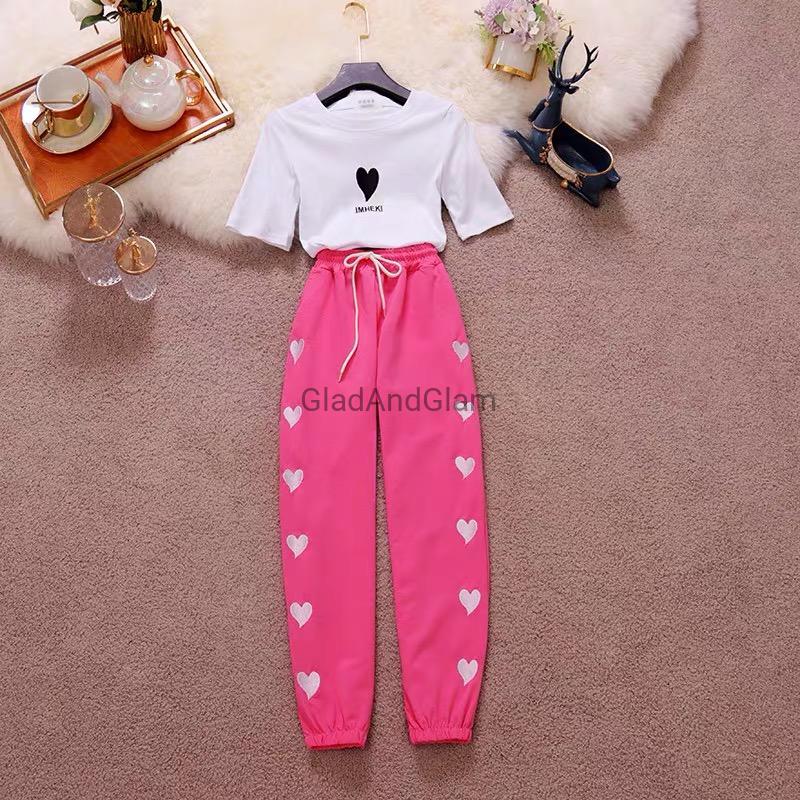 Women’s Charlotte Heart Print Co-Ord Set displayed flat with matching graphic tee and heart print joggers