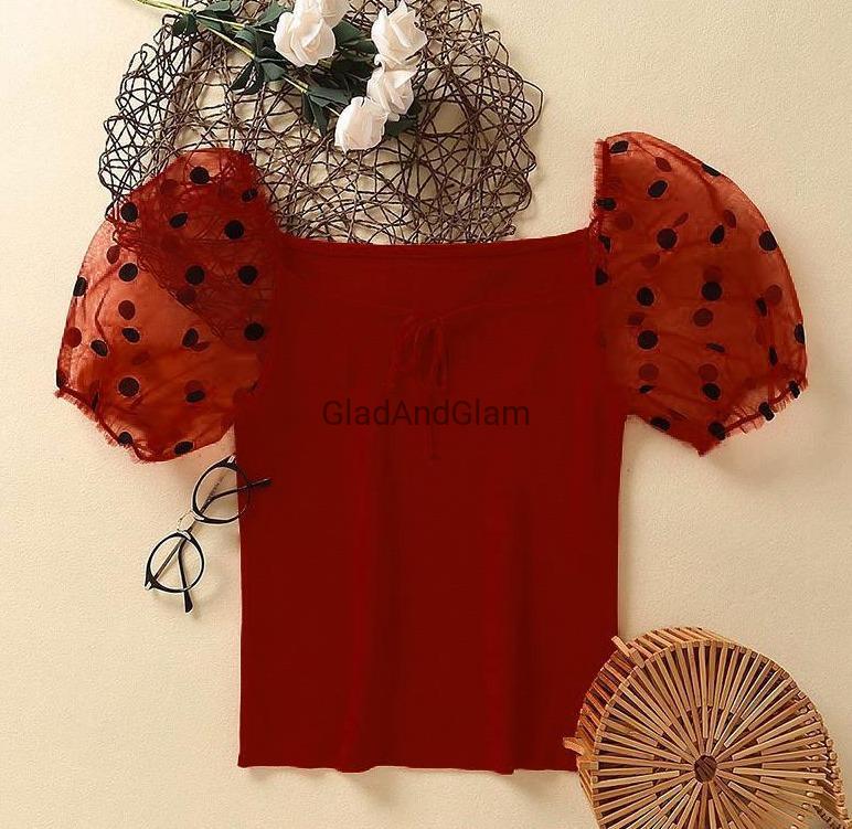 red top with black polka dots